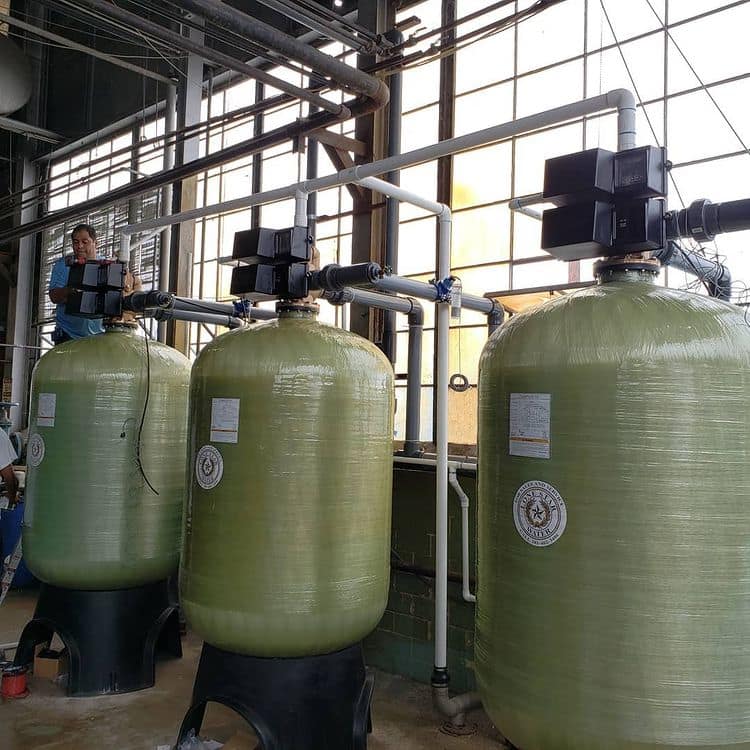 Industrial water filtration tanks in a factory.
