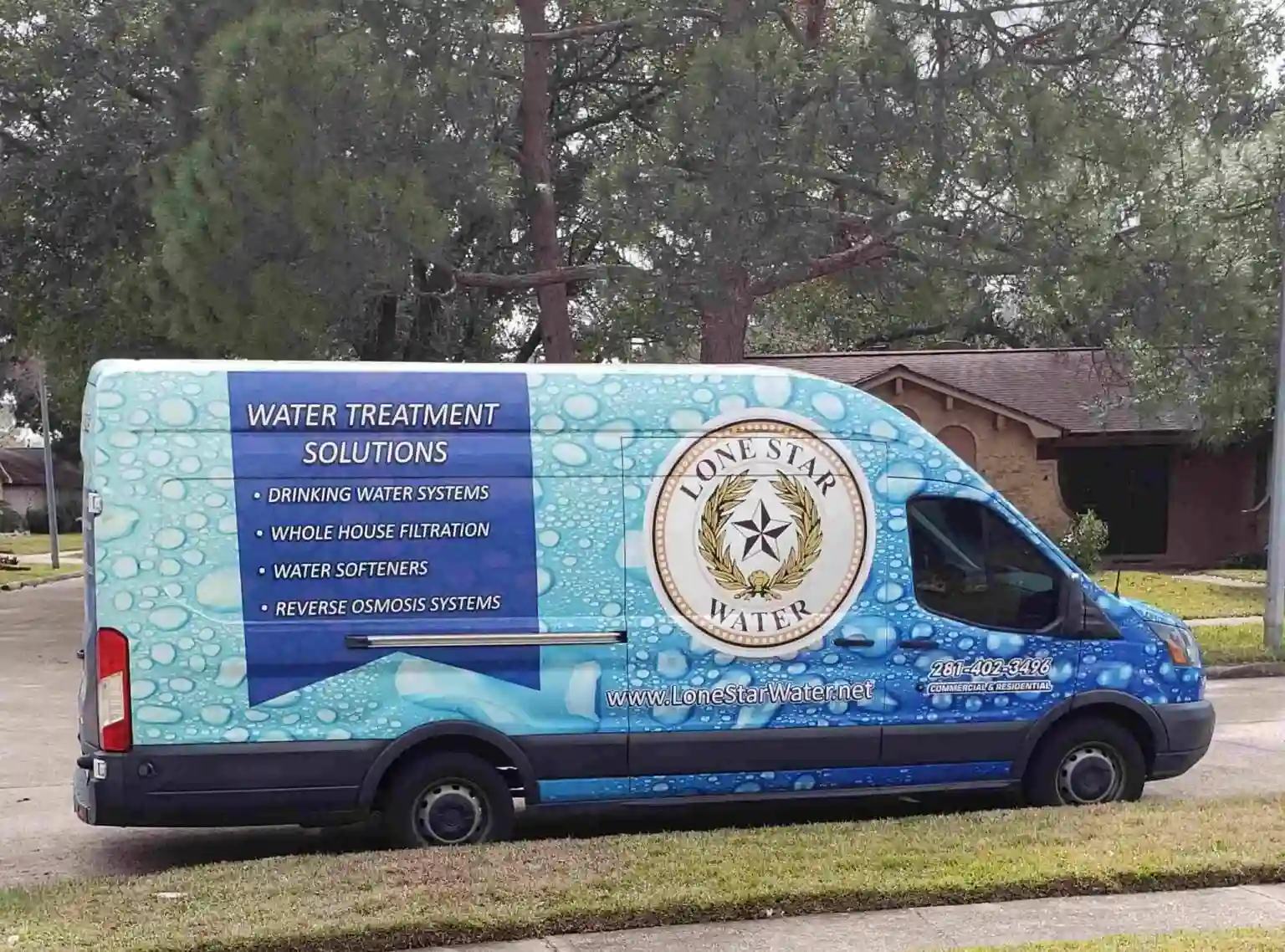Blue Lone Star Water service van with logo