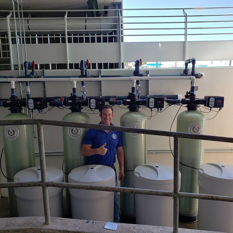 Lone Star Water staff with industrial water purification machines