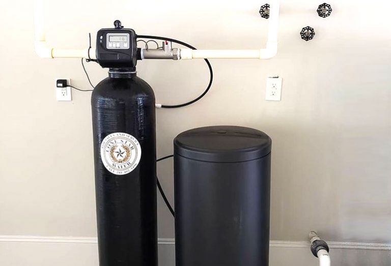 Water softener system with two black tanks.