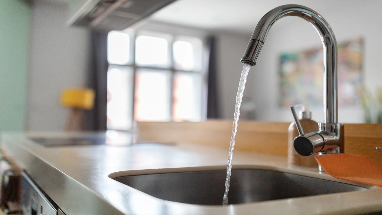 modern kitchen sink with a sleek faucet dispensing clear water