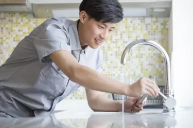 man with tap water